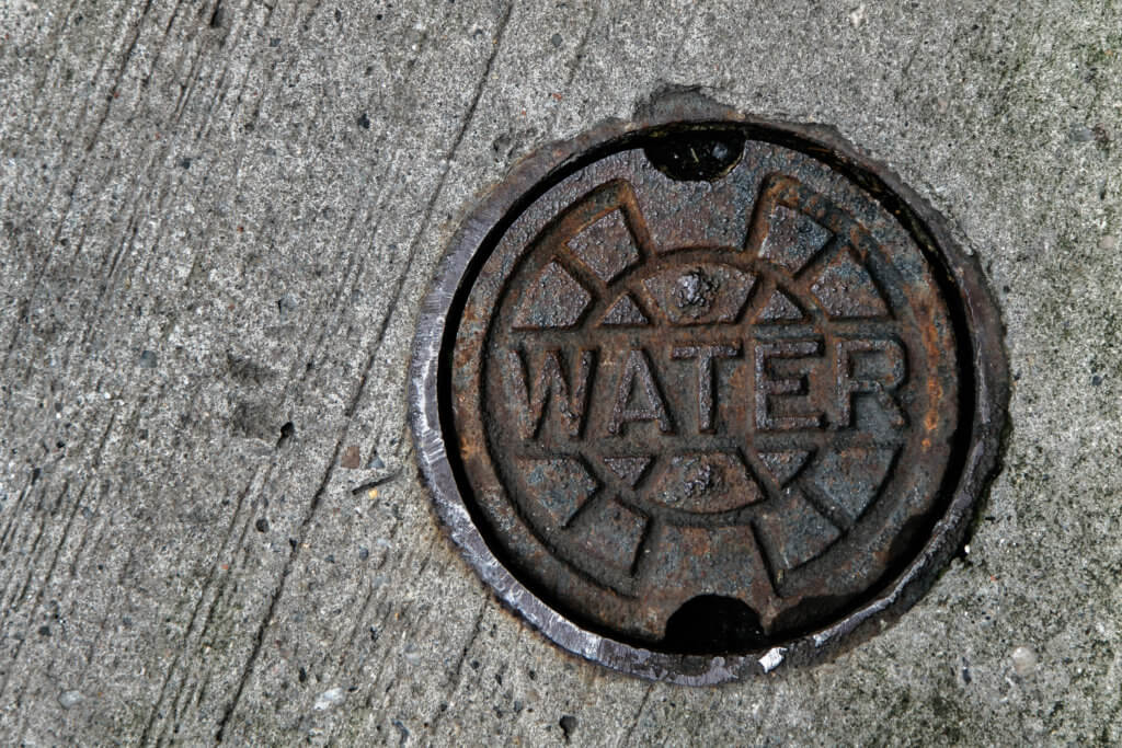 Water supply manhole cover. Access point to water main.